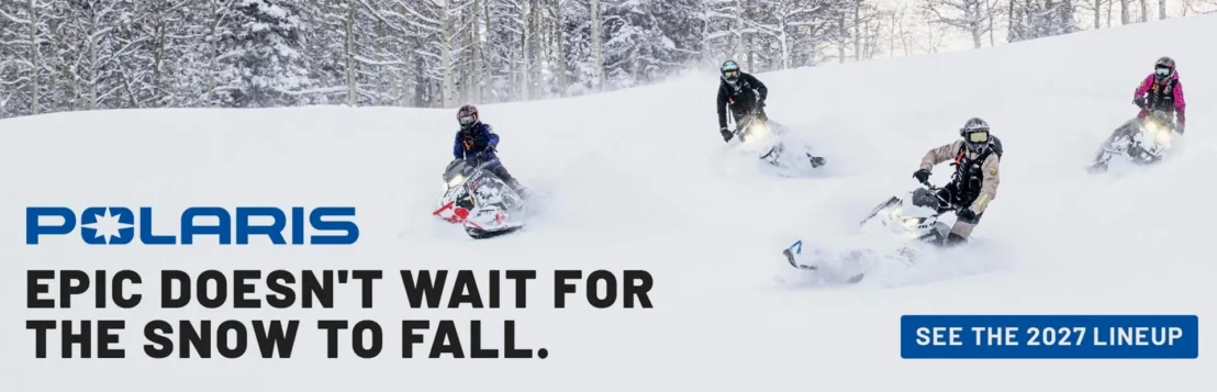 Polaris promotional banner featuring snowmobile riders carving through deep snow with “Epic Doesn't Wait for the Snow to Fall” campaign and 2027 lineup call-to-action